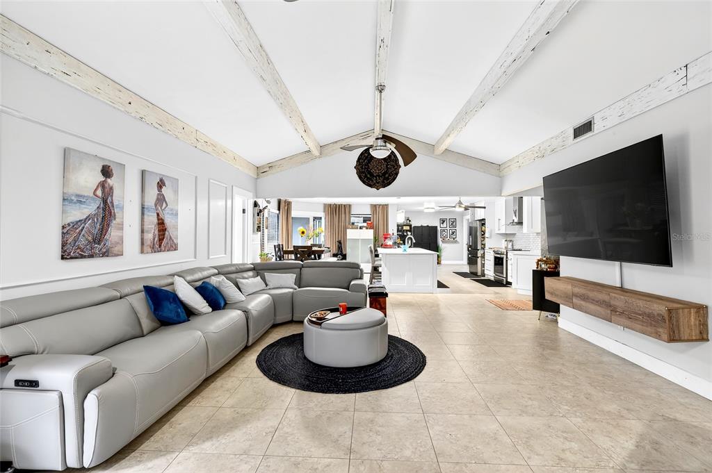 11795 Southwest Highway 484 Dunnellon, FL 34432 - Photo 25 of 51 a living room with furniture and a flat screen tv