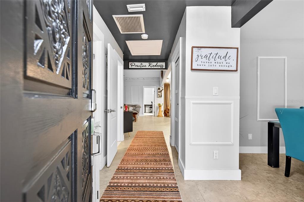 11795 Southwest Highway 484 Dunnellon, FL 34432 - Photo 3 of 51 a view of a hallway with paintings on the wall