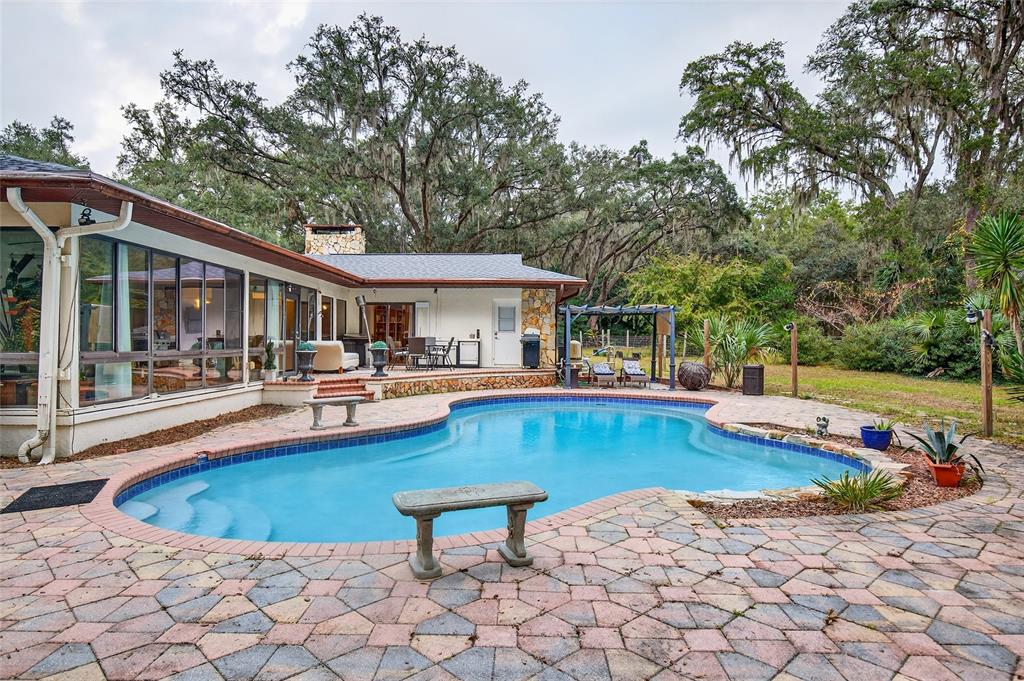 11795 Southwest Highway 484 Dunnellon, FL 34432 - Photo 41 of 51 a view of a swimming pool with chairs