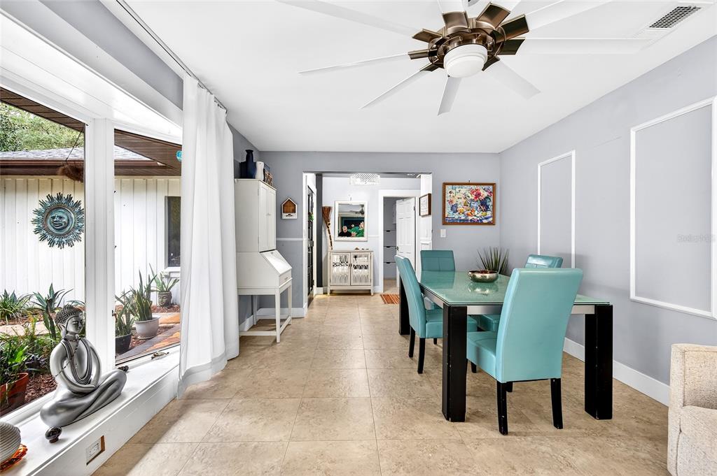 11795 Southwest Highway 484 Dunnellon, FL 34432 - Photo 5 of 51 a living room with furniture a chandelier and a dining room