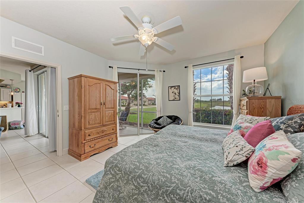 23261 Banbury Way, Unit 501 Venice, FL 34293 - Photo 19 of 75 a bed room with a bed and a window