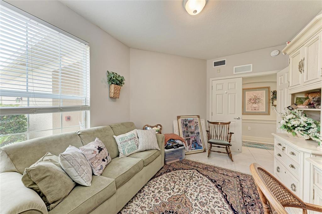 23261 Banbury Way, Unit 501 Venice, FL 34293 - Photo 24 of 75 a living room with furniture and a rug