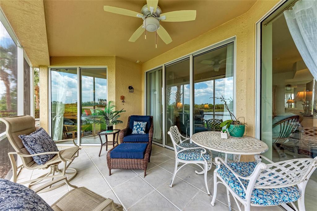 23261 Banbury Way, Unit 501 Venice, FL 34293 - Photo 33 of 75 a living room with furniture and a table