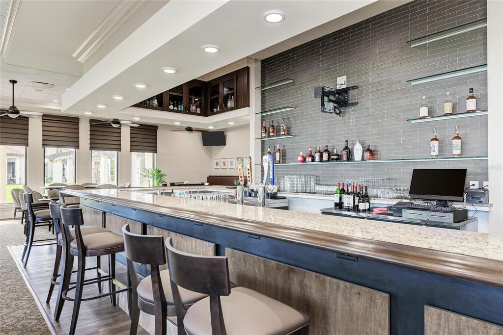 23261 Banbury Way, Unit 501 Venice, FL 34293 - Photo 60 of 75 a kitchen with stainless steel appliances kitchen island granite countertop a sink and cabinets