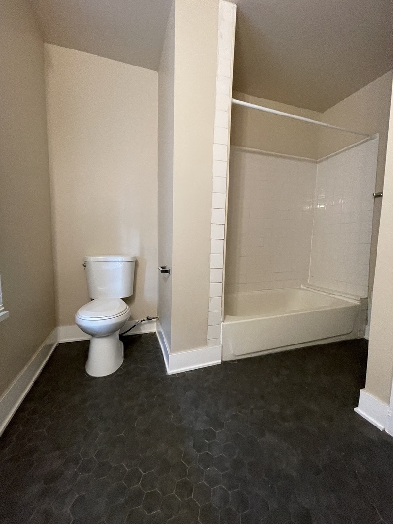 11634 South Princeton Avenue Chicago, IL 60628 - Photo 15 of 18 a view of a bathroom with a toilet
