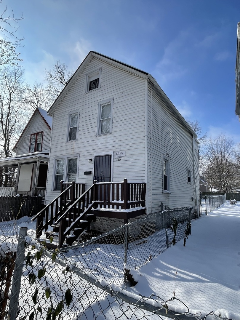 11634 South Princeton Avenue Chicago, IL 60628 - Photo 2 of 18 a view of a house with wooden deck and furniture