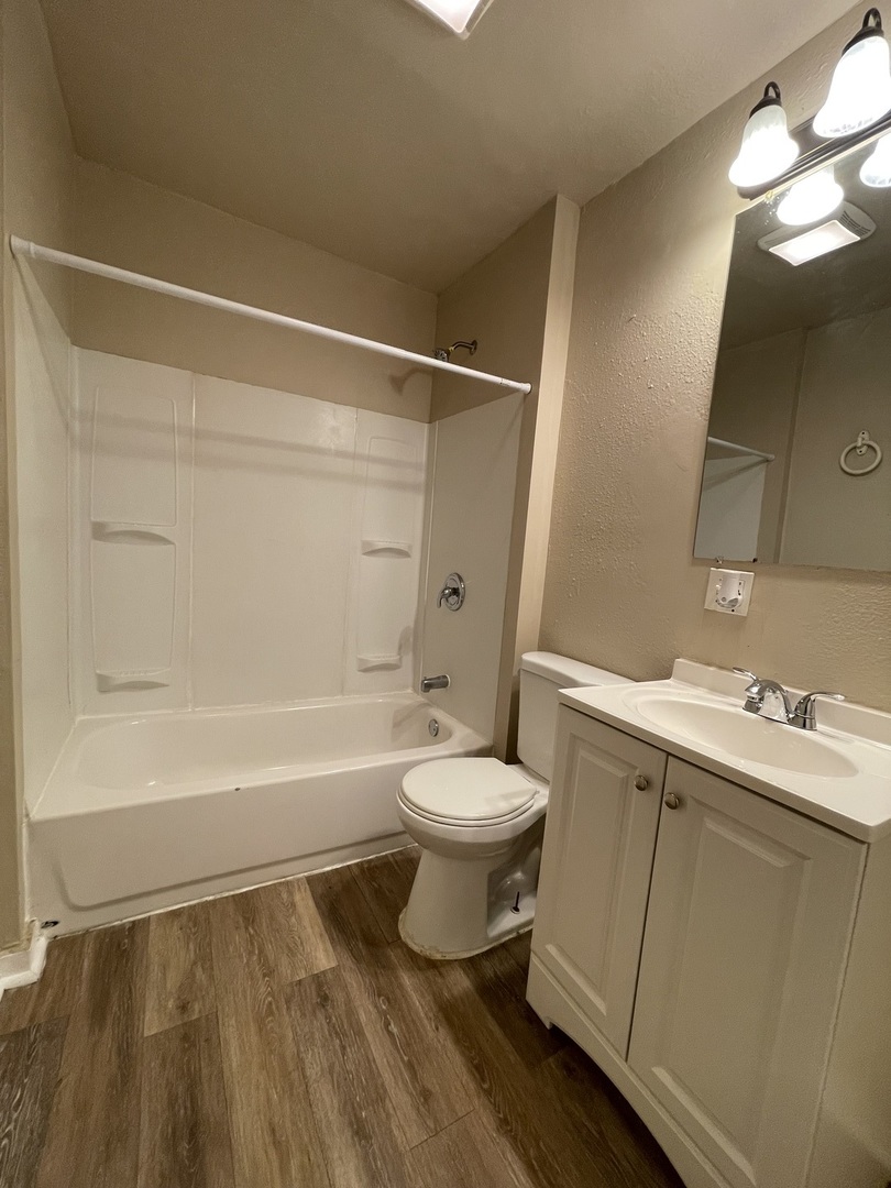 11634 South Princeton Avenue Chicago, IL 60628 - Photo 6 of 18 a bathroom with a sink toilet and shower