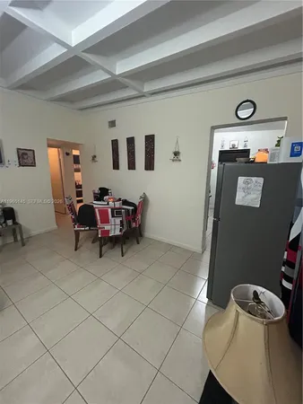 a room with furniture and musical instruments