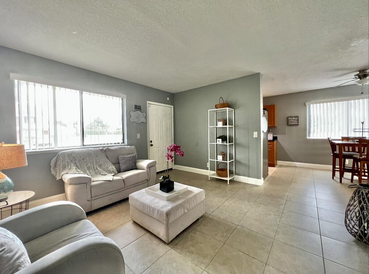 600 Nottingham Circle Greenacres, FL 33463 - Photo 2 of 19 a living room with furniture and a large window