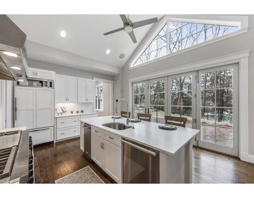 120 Galloupes Point Road Swampscott, MA 01907 - Photo 11 of 30 a large white kitchen with a large window