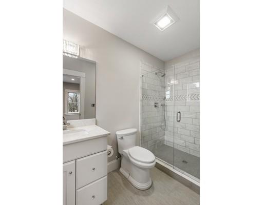 120 Galloupes Point Road Swampscott, MA 01907 - Photo 15 of 30 a bathroom with a toilet a sink a mirror and shower