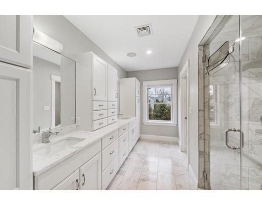 120 Galloupes Point Road Swampscott, MA 01907 - Photo 17 of 30 a bathroom with a double vanity sink and mirror with shower