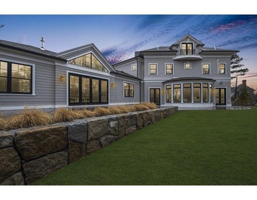 120 Galloupes Point Road Swampscott, MA 01907 - Photo 2 of 30 a front view of a house with a garden