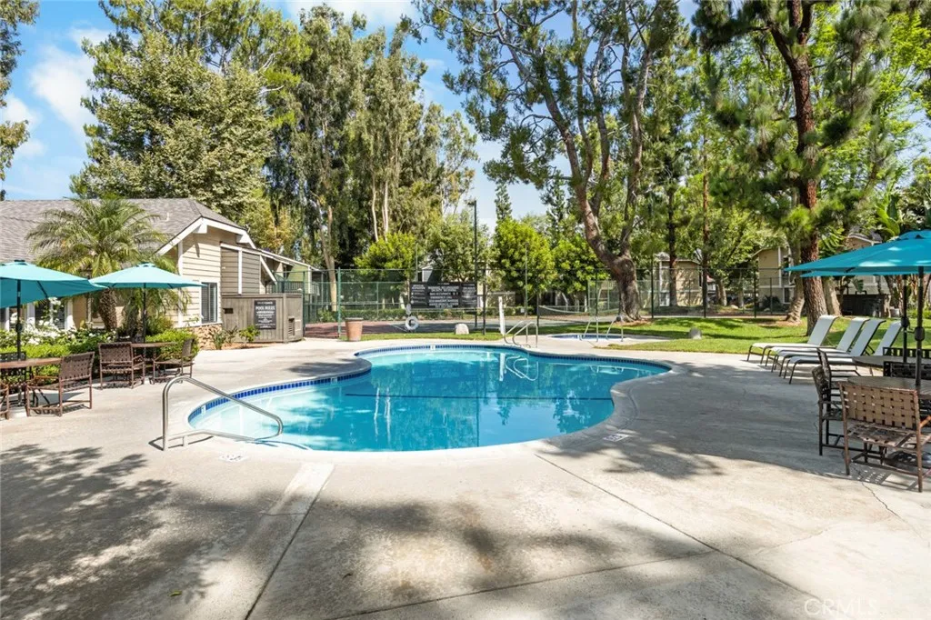 3535 Banbury Drive, Unit 158 Riverside, CA 92501 - Photo 3 of 15 a view of a swimming pool with a patio