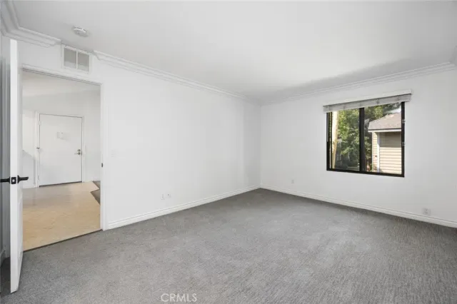 a view of a hallway with washer and dryer