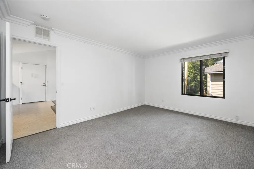 3535 Banbury Drive, Unit 158 Riverside, CA 92501 - Photo 10 of 15 an empty room with windows