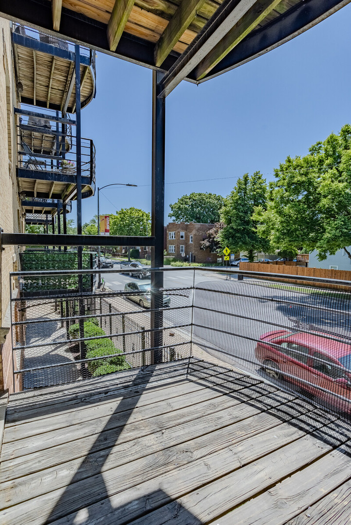 3100 West Addison Street, Unit 1A Chicago, IL 60618 - Photo 15 of 29 a view of a balcony with wooden floor