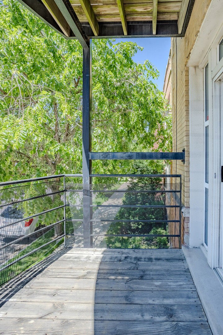 3100 West Addison Street, Unit 1A Chicago, IL 60618 - Photo 16 of 29 a view of a balcony with wooden floor