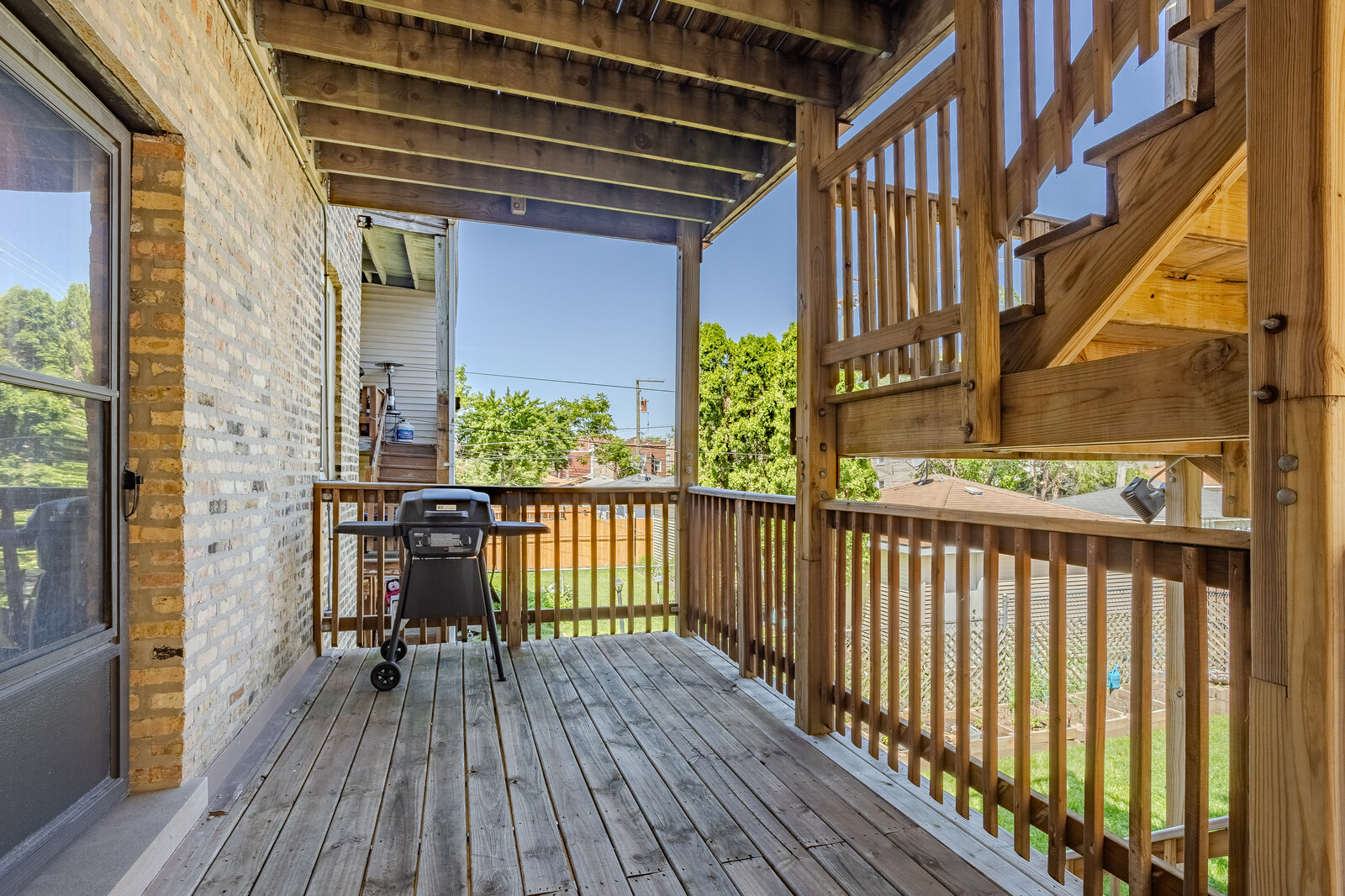 3100 West Addison Street, Unit 1A Chicago, IL 60618 - Photo 26 of 29 a view of balcony with wooden floor and seating space