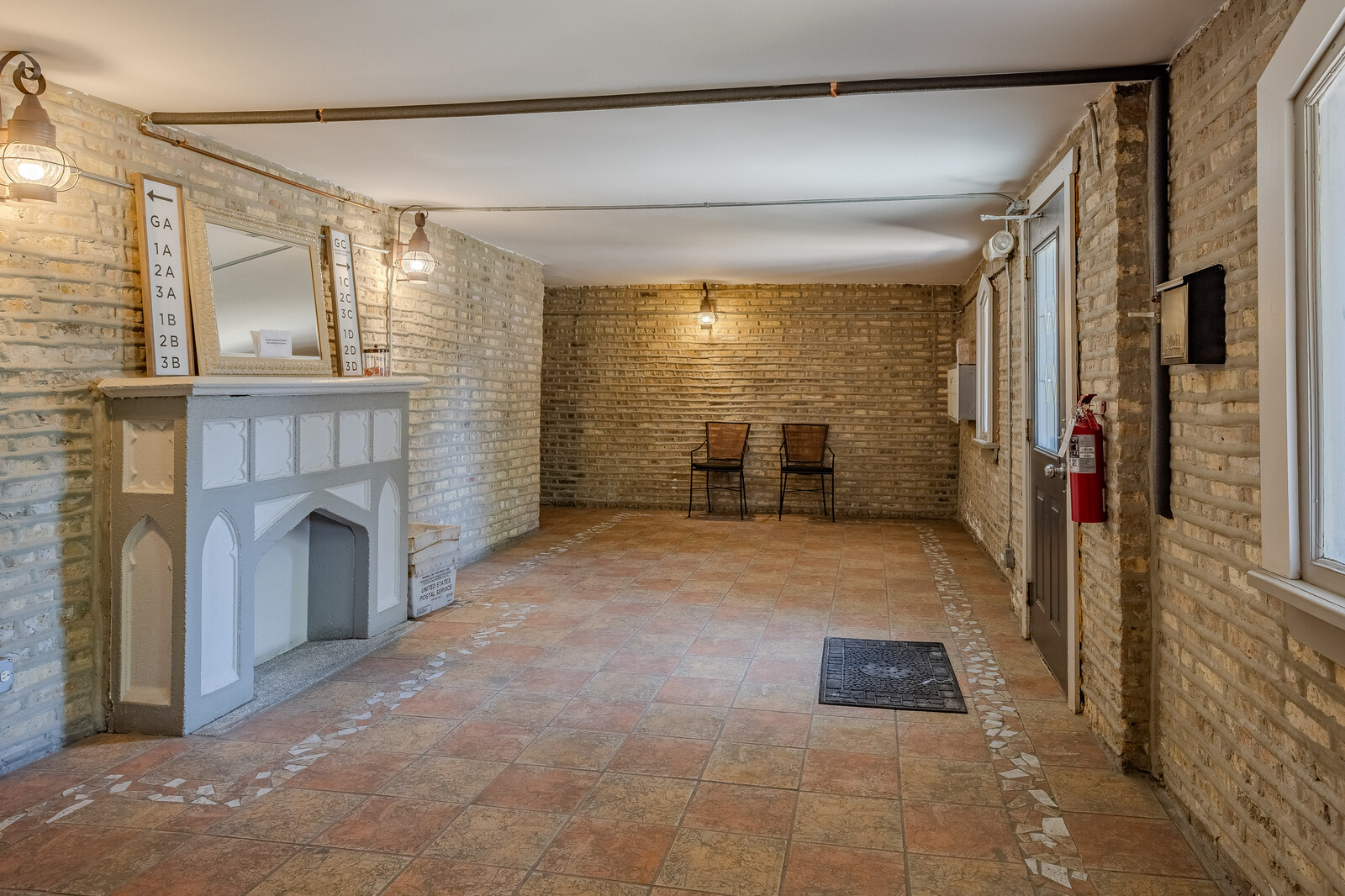 3100 West Addison Street, Unit 1A Chicago, IL 60618 - Photo 4 of 29 a view of an empty room with a fireplace and a window