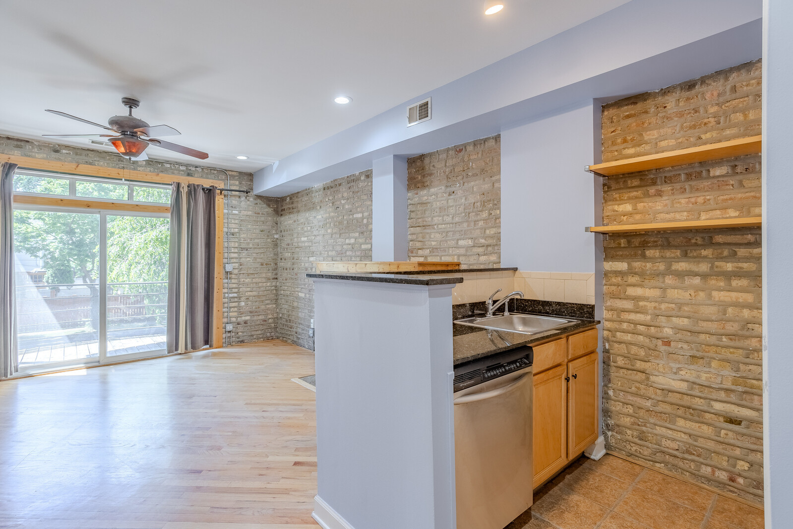 3100 West Addison Street, Unit 1A Chicago, IL 60618 - Photo 10 of 29 a kitchen that has a sink stainless steel appliances and cabinets