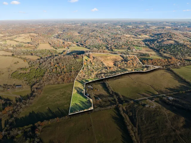 an aerial view of residential building and ocean