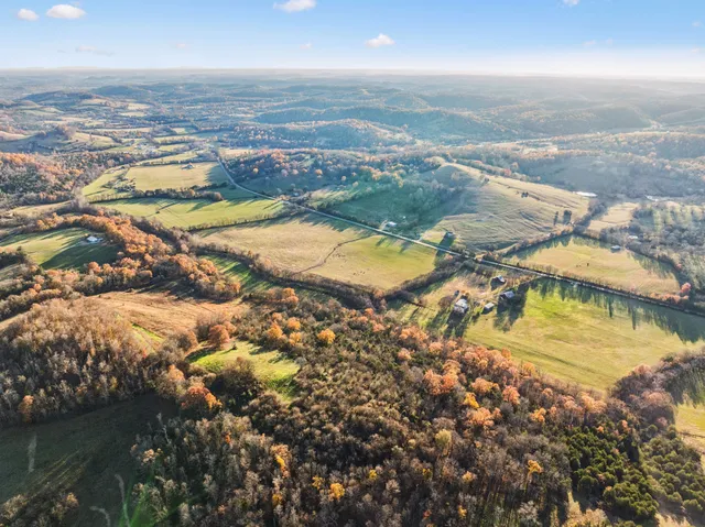 an aerial view of residential building and lake