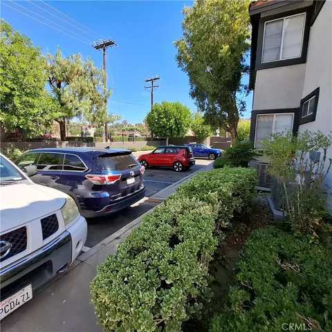 a view of a yard with cars