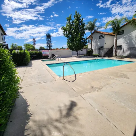 a view of a backyard with plants and a patio