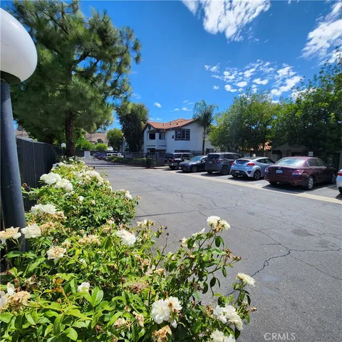 a couple of cars parked in front of a house