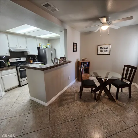 a kitchen with a cabinets and chairs