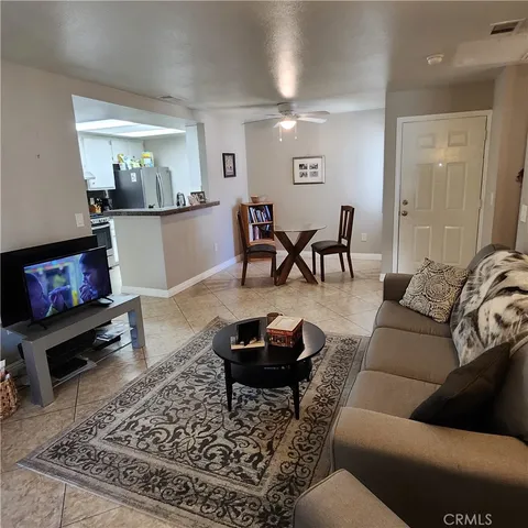 a living room with furniture and a rug