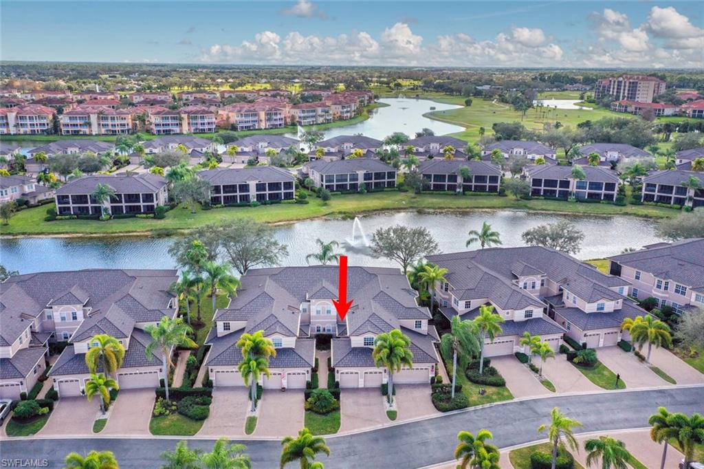 793 Regency Reserve Circle, Unit 4502 Naples, FL 34119 - Photo 2 of 24 an aerial view of a house with a garden and lake view