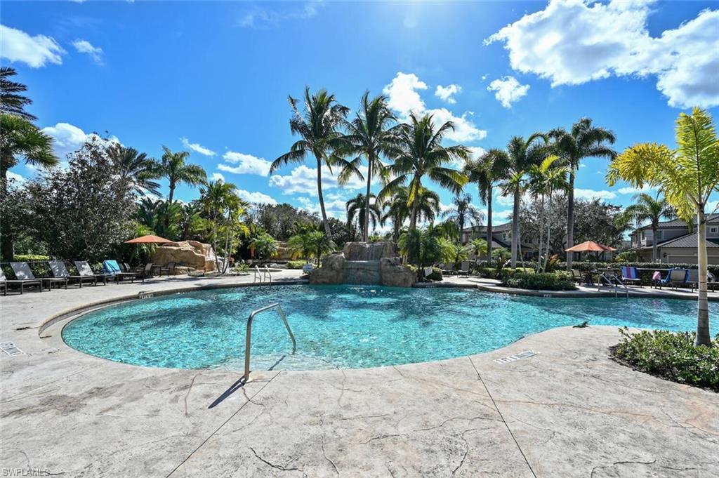 793 Regency Reserve Circle, Unit 4502 Naples, FL 34119 - Photo 23 of 24 a view of backyard with swimming pool and outdoor seating