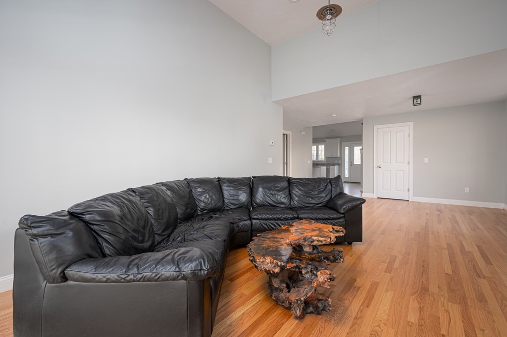 5 Turtle Lane, Unit 5 Sterling, MA 01564 - Photo 12 of 30 a living room with furniture and a wooden floor