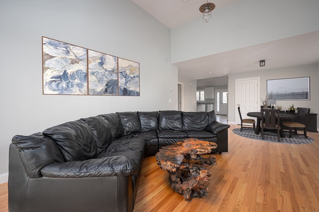 5 Turtle Lane, Unit 5 Sterling, MA 01564 - Photo 13 of 30 a living room with furniture and wooden floor