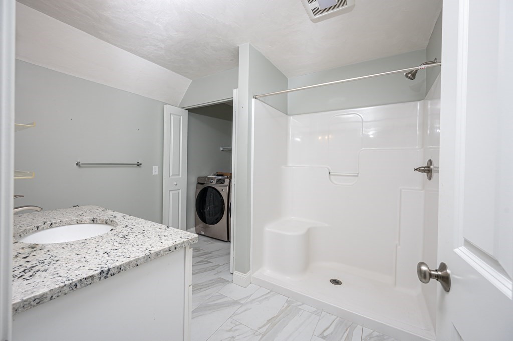 5 Turtle Lane, Unit 5 Sterling, MA 01564 - Photo 16 of 30 a bathroom with a sink a toilet and shower
