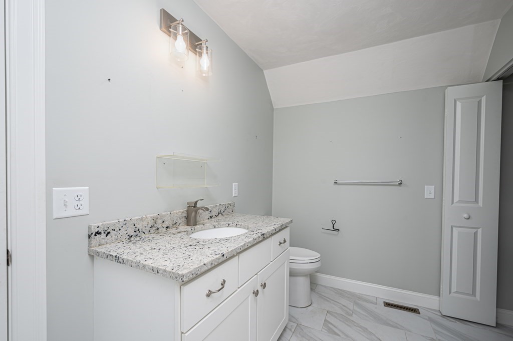 5 Turtle Lane, Unit 5 Sterling, MA 01564 - Photo 17 of 30 a bathroom with a granite countertop sink toilet and shower
