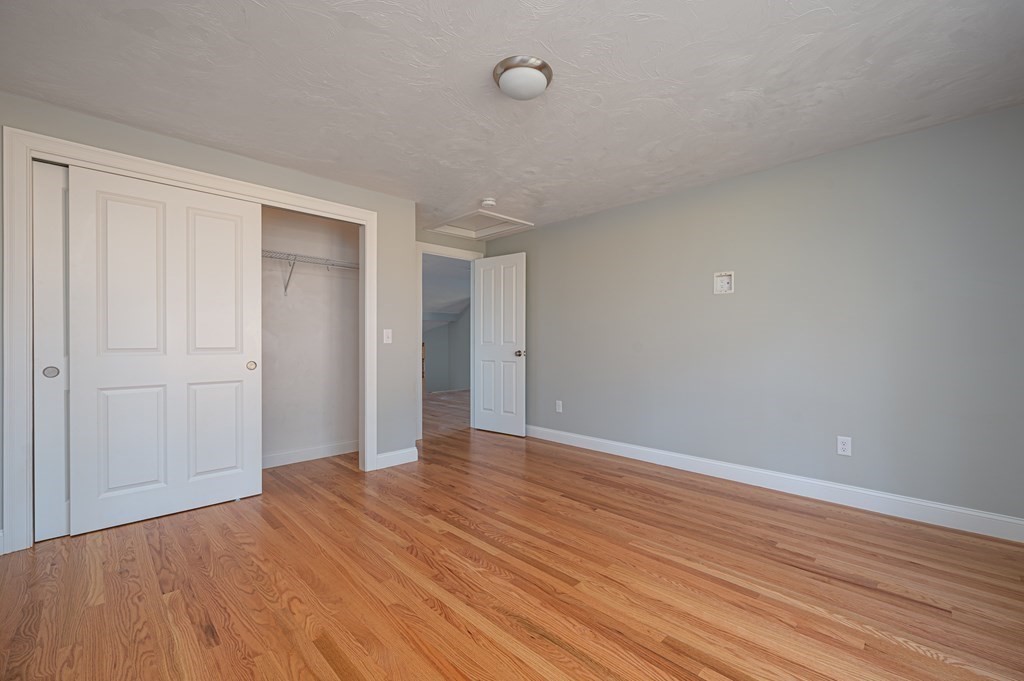 5 Turtle Lane, Unit 5 Sterling, MA 01564 - Photo 20 of 30 a view of an empty room with wooden floor