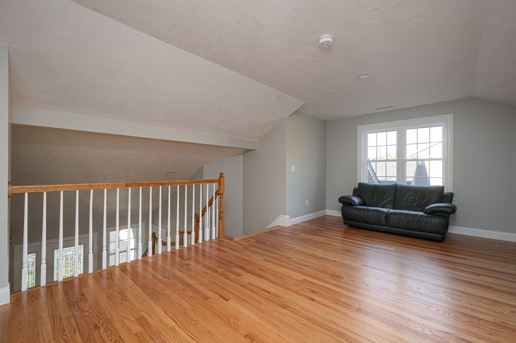 5 Turtle Lane, Unit 5 Sterling, MA 01564 - Photo 21 of 30 a living room with furniture and a wooden floor