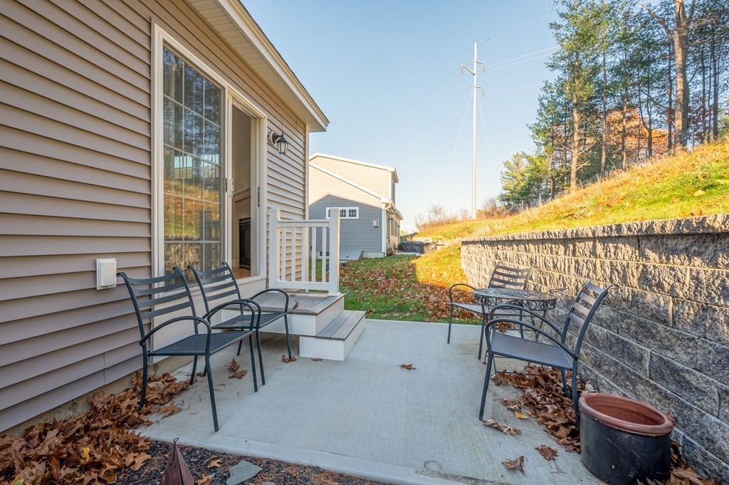5 Turtle Lane, Unit 5 Sterling, MA 01564 - Photo 24 of 30 a view of a chairs and table in patio