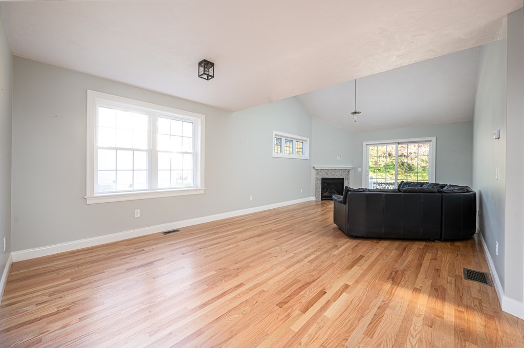 5 Turtle Lane, Unit 5 Sterling, MA 01564 - Photo 8 of 30 a living room with a bed and a window