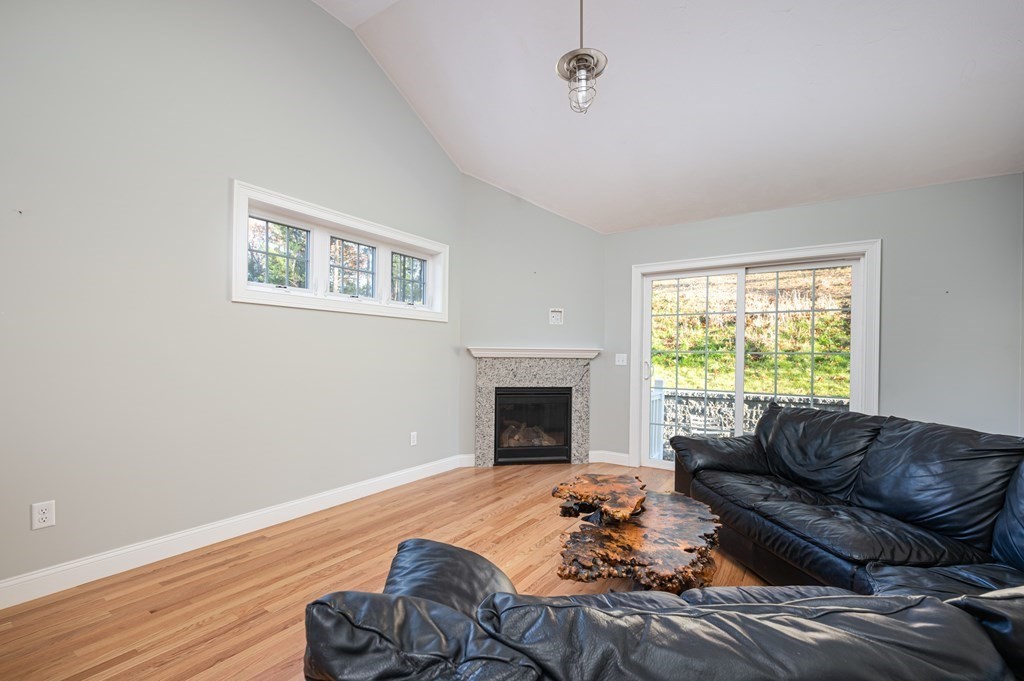 5 Turtle Lane, Unit 5 Sterling, MA 01564 - Photo 10 of 30 a living room with furniture and a fireplace