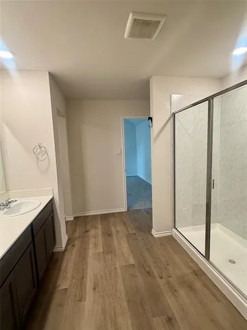 a view of a kitchen with a sink and a stove top oven