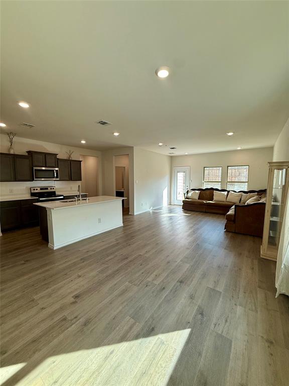 916 Country Road Royse City, TX 75189 - Photo 6 of 24 a view of kitchen with furniture and wooden floor