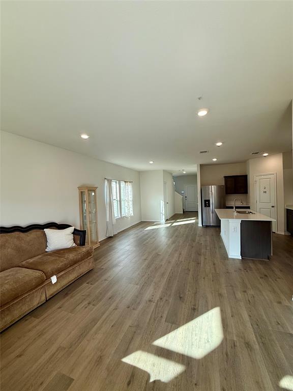 916 Country Road Royse City, TX 75189 - Photo 9 of 24 a living room with furniture and kitchen view with wooden floor