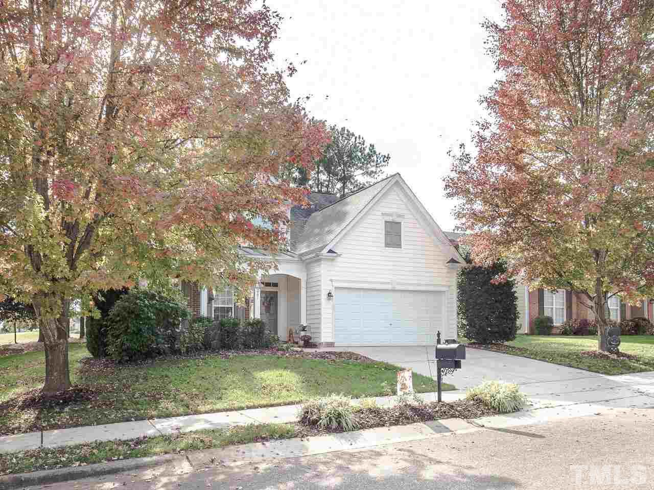 3901 Cathedral Bell Road Raleigh, NC 27614 - Photo 2 of 30 a front view of a house with a yard and garage