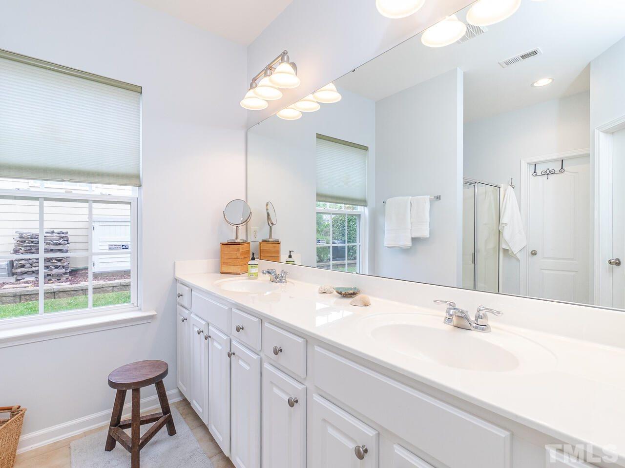 3901 Cathedral Bell Road Raleigh, NC 27614 - Photo 17 of 30 a bathroom with a sink and a mirror