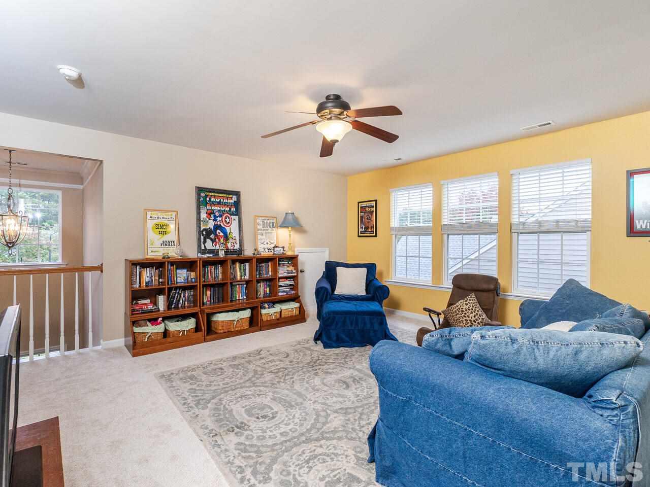 3901 Cathedral Bell Road Raleigh, NC 27614 - Photo 20 of 30 a living room with furniture and a large window