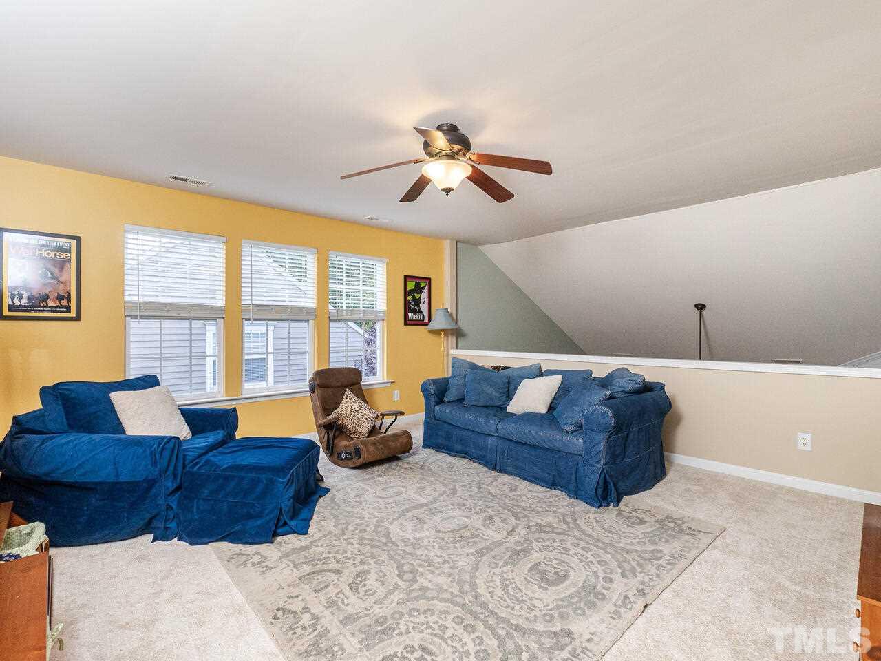 3901 Cathedral Bell Road Raleigh, NC 27614 - Photo 22 of 30 a living room with furniture and a large window